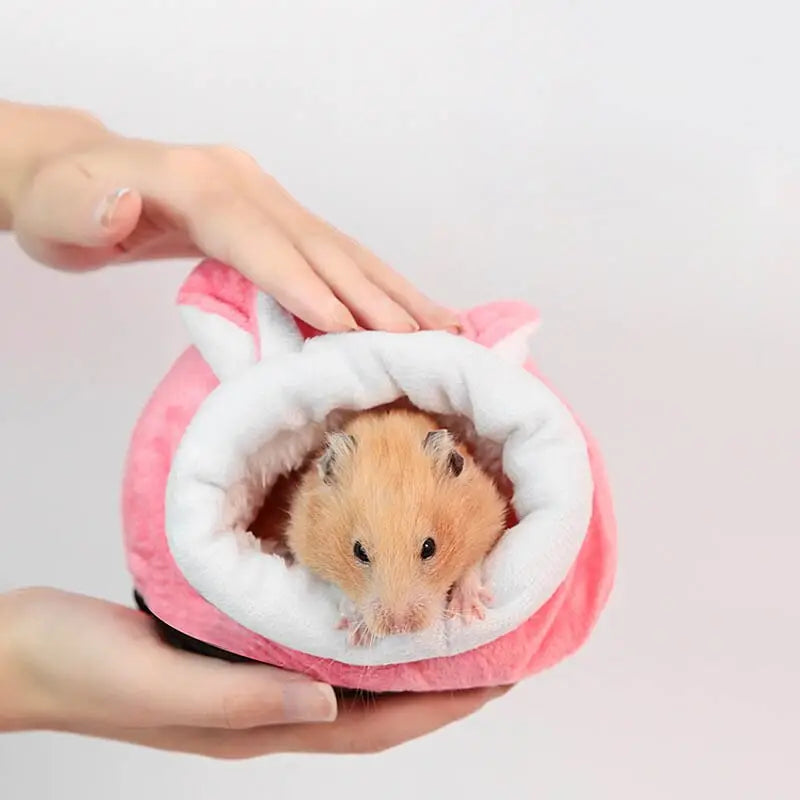 Personne tenant un hamster en tenue rose et blanche, Cozy Cotton House for Your Petit Companion